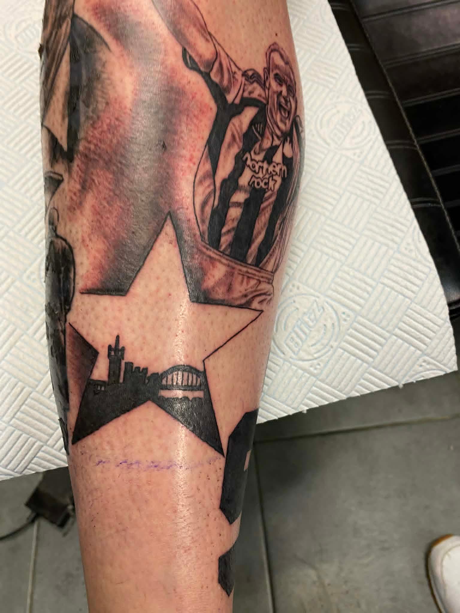 NUFC Alan Shearer goal celebration portrait with Newcastle skyline star on the calf by John Quinn at Tattoo Zone, tattoos Newcastle.