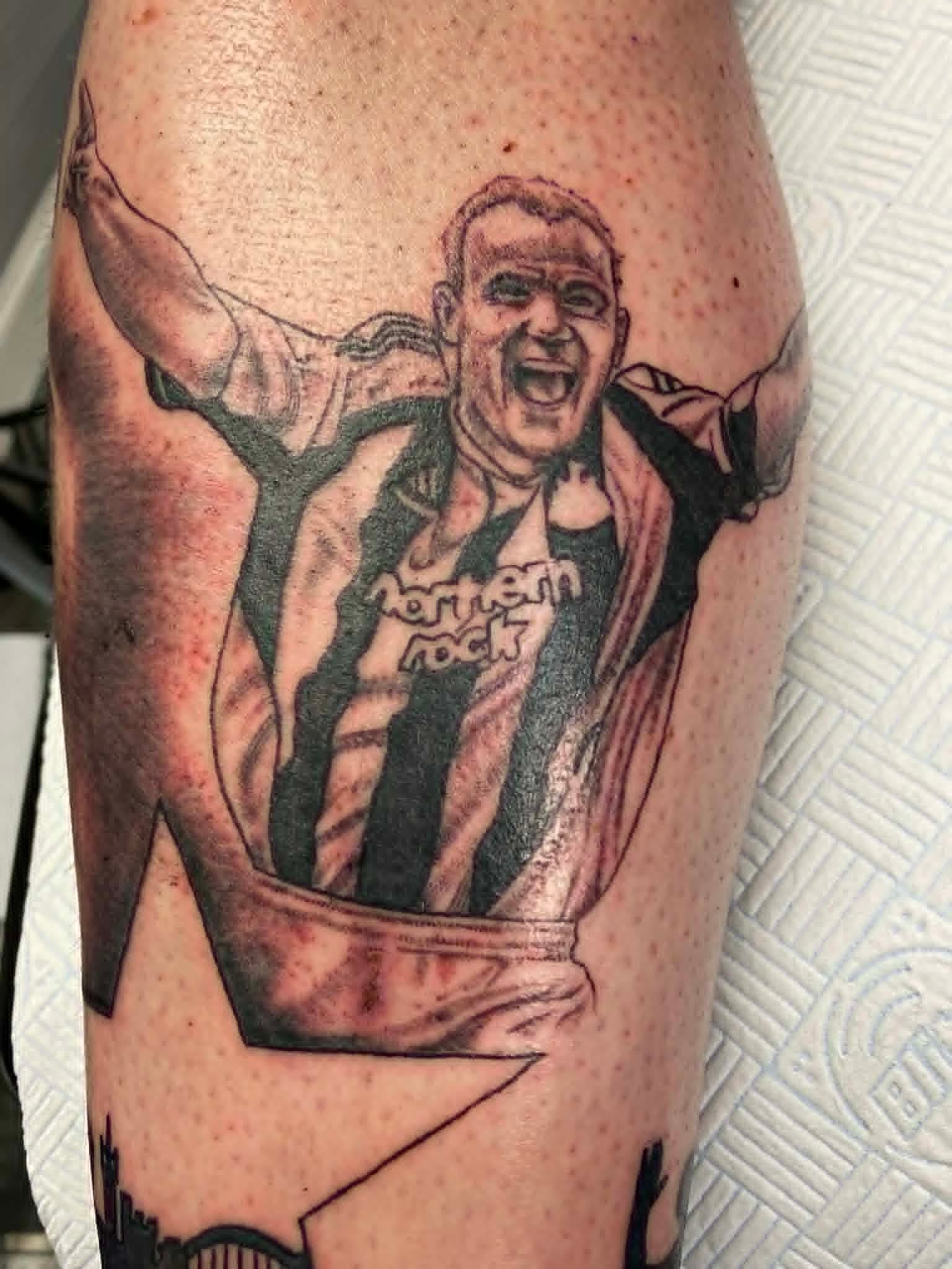 NUFC Alan Shearer goal celebration portrait in Newcastle United stripes on the calf by John Quinn at Tattoo Zone, tattoos Newcastle.