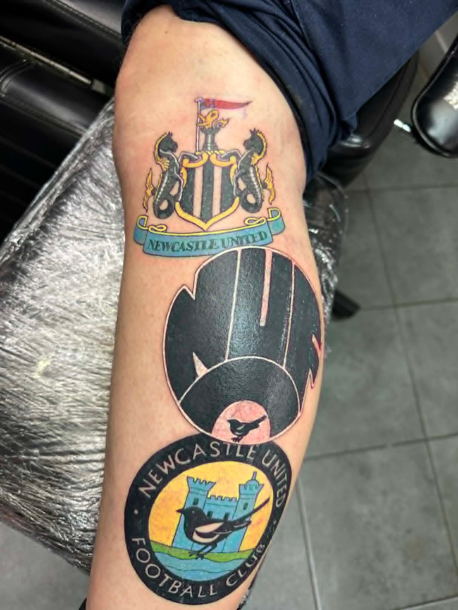 Newcastle United crest, retro badge and football collage on calf by John Quinn at Tattoo Zone, tattoos Newcastle.