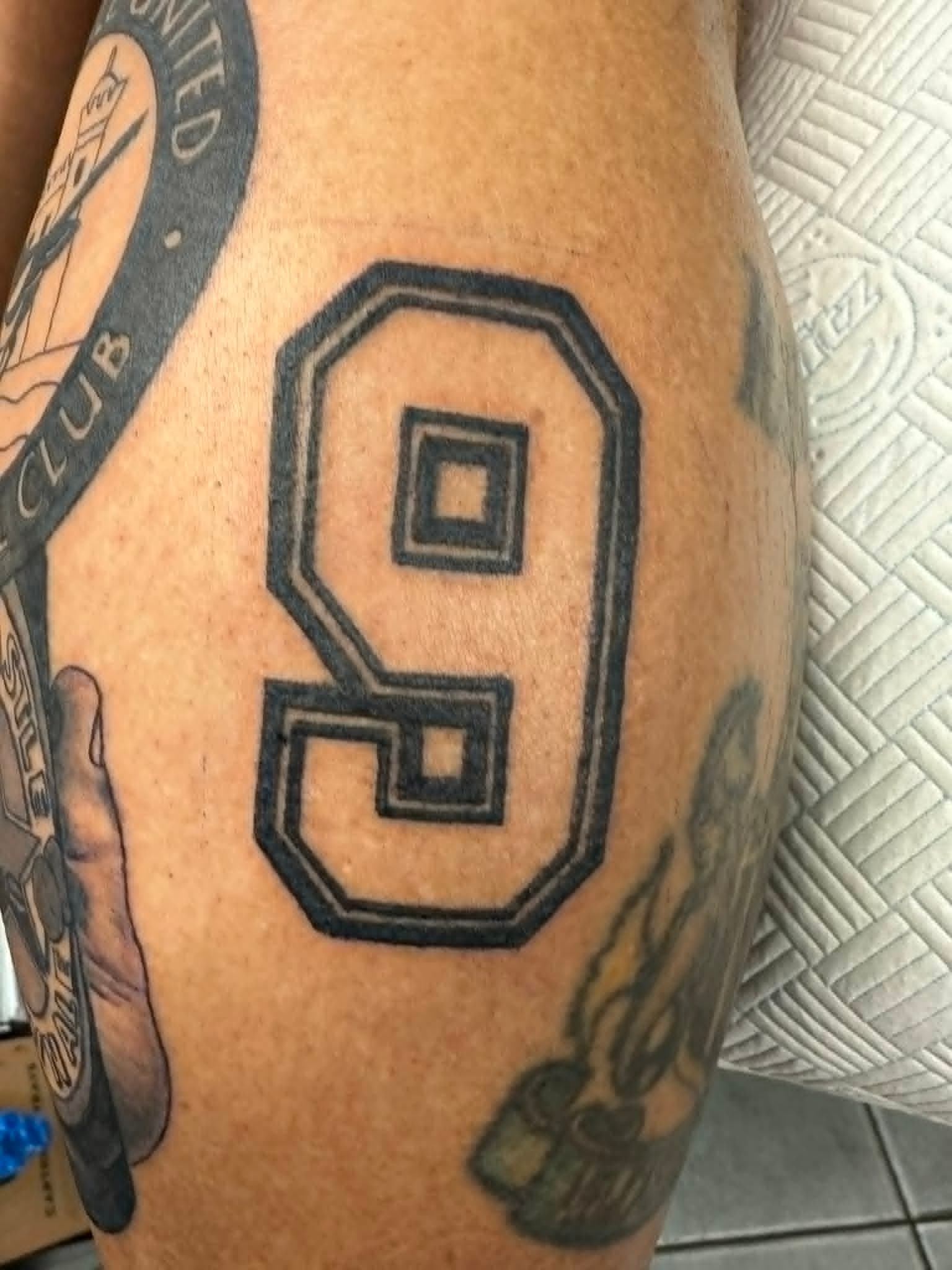 Newcastle United number nine shirt thigh tattoo by John Quinn at Tattoo Zone, tattoos Newcastle.