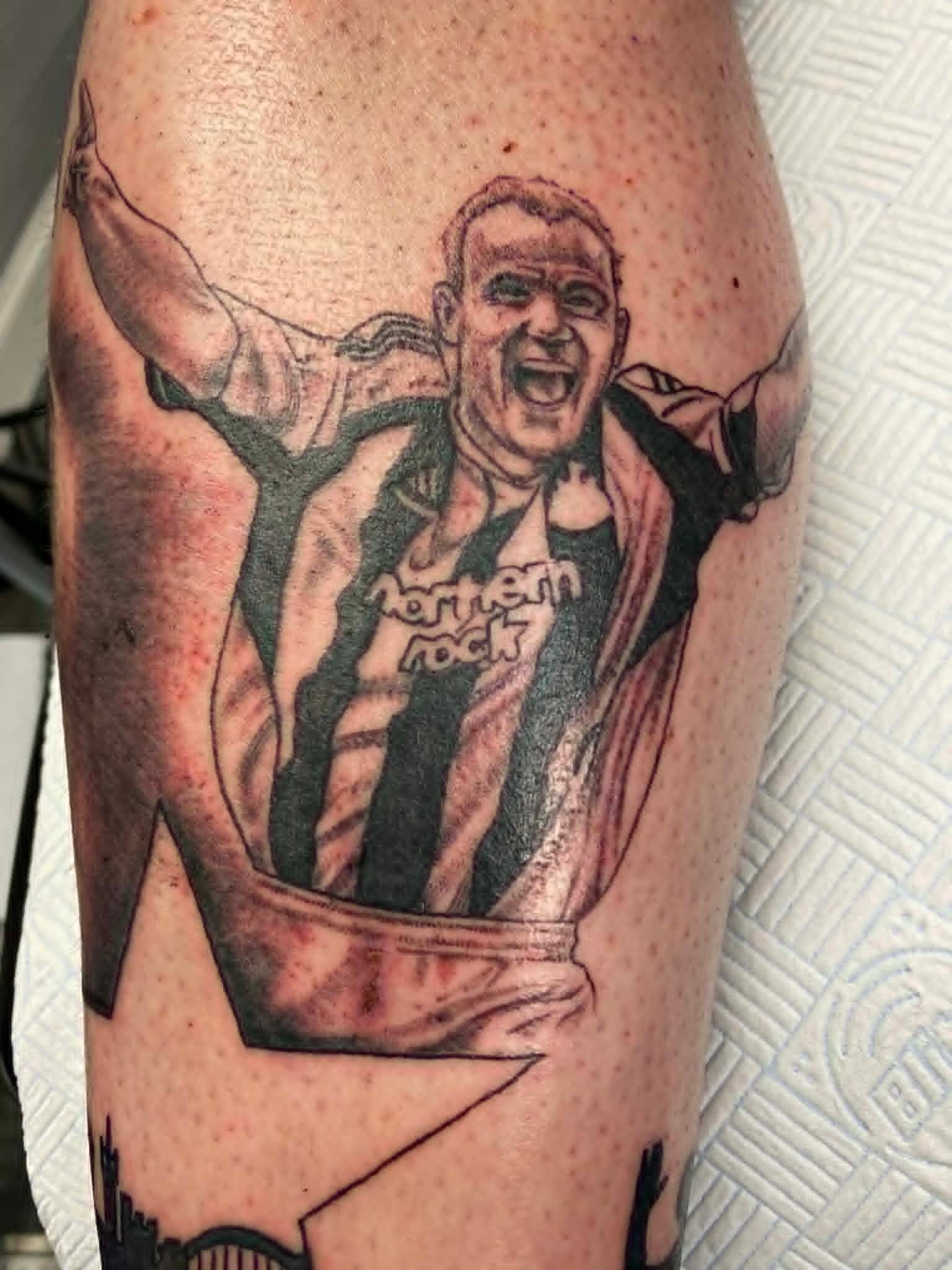 NUFC Alan Shearer goal celebration portrait in Newcastle United stripes on the calf by John Quinn at Tattoo Zone, tattoos Newcastle.