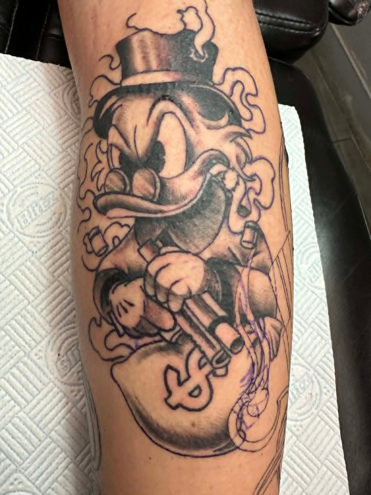 Custom illustrative tattoo by John Quinn at Tattoo Zone Newcastle.
