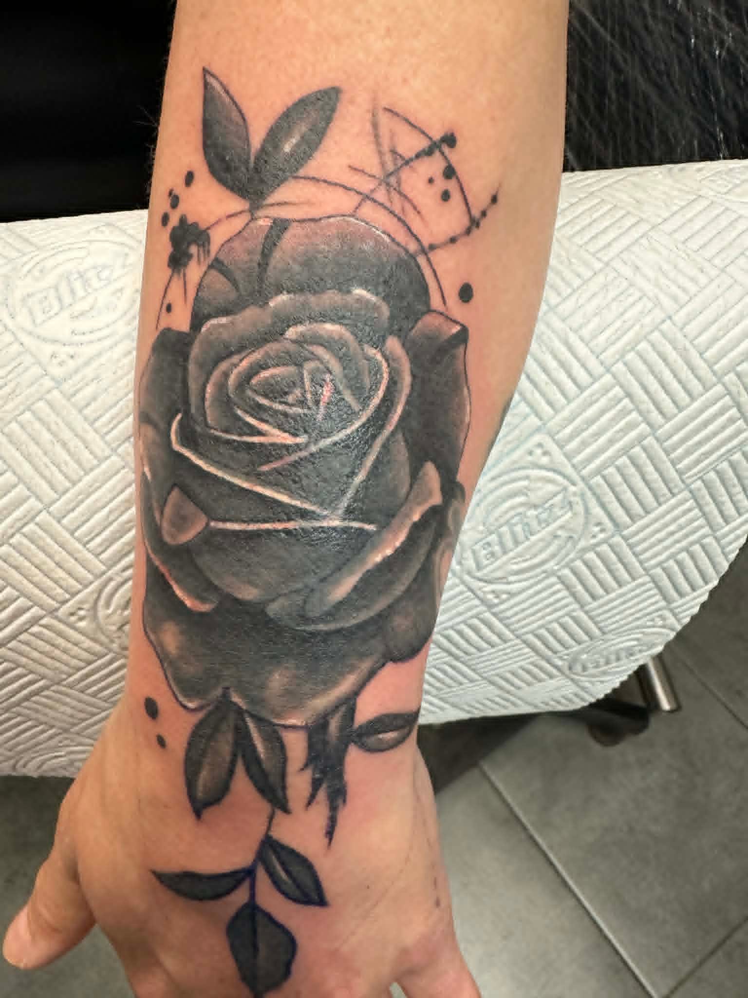 Fine line botanical tattoo by John Quinn at Tattoo Zone Newcastle.