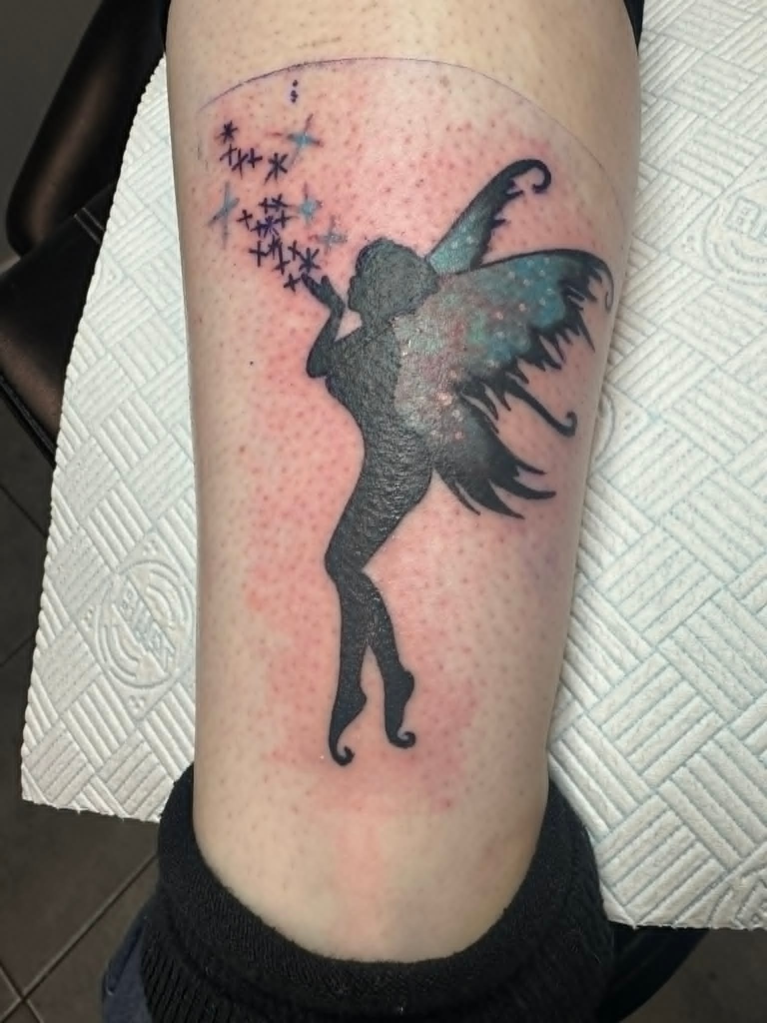Galaxy silhouette fairy cover up tattoo on arm by John Quinn at Tattoo Zone, tattoos Newcastle.