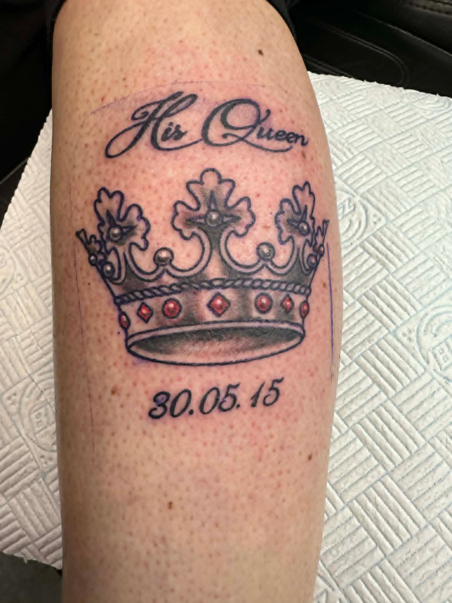 Custom His Queen script with regal crown and date calf tattoo by John Quinn at Tattoo Zone Newcastle.