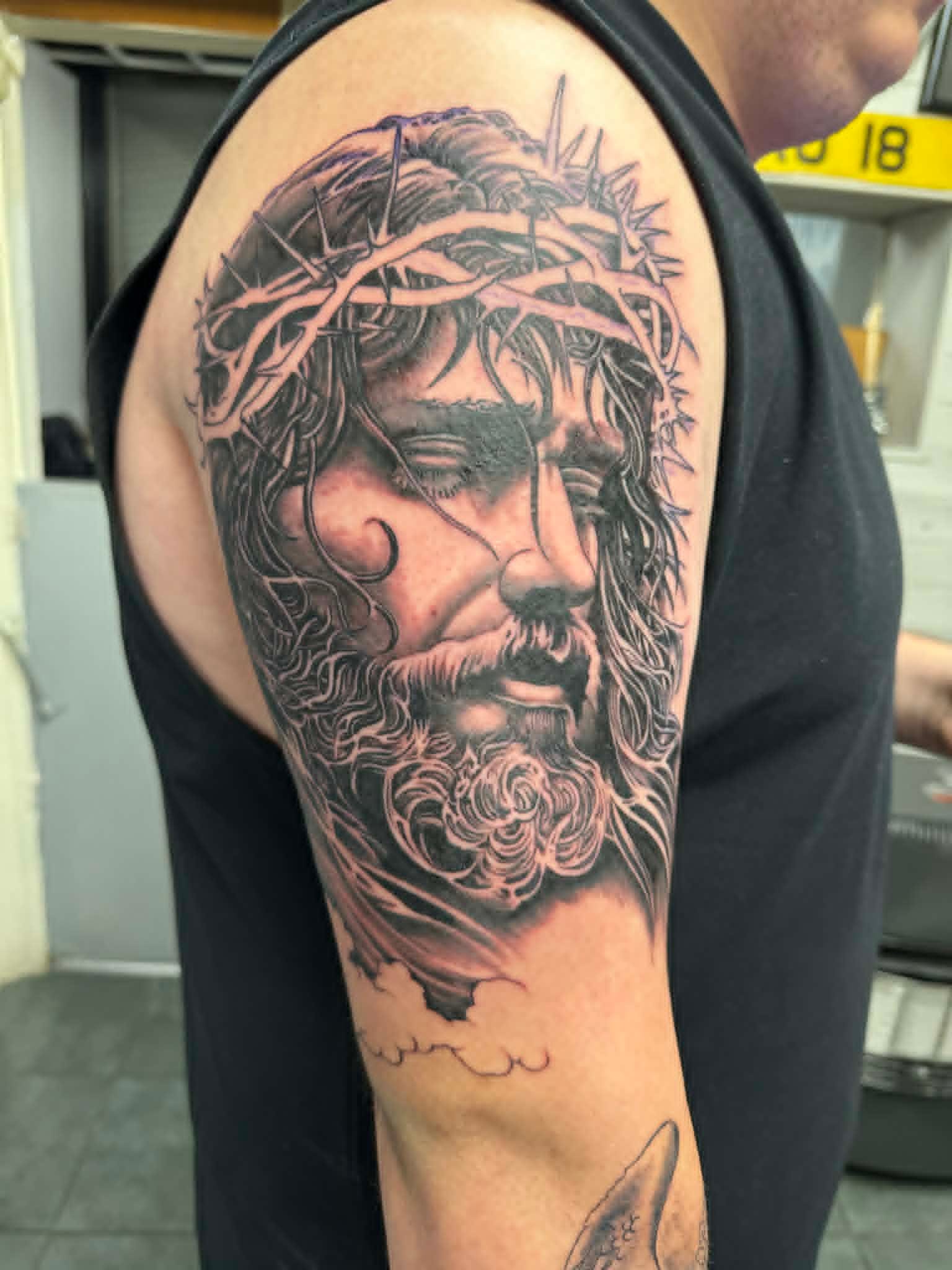 Black and grey Jesus Christ crown of thorns half sleeve tattoo, religious tattoos Newcastle, Tattoo Zone Byker.