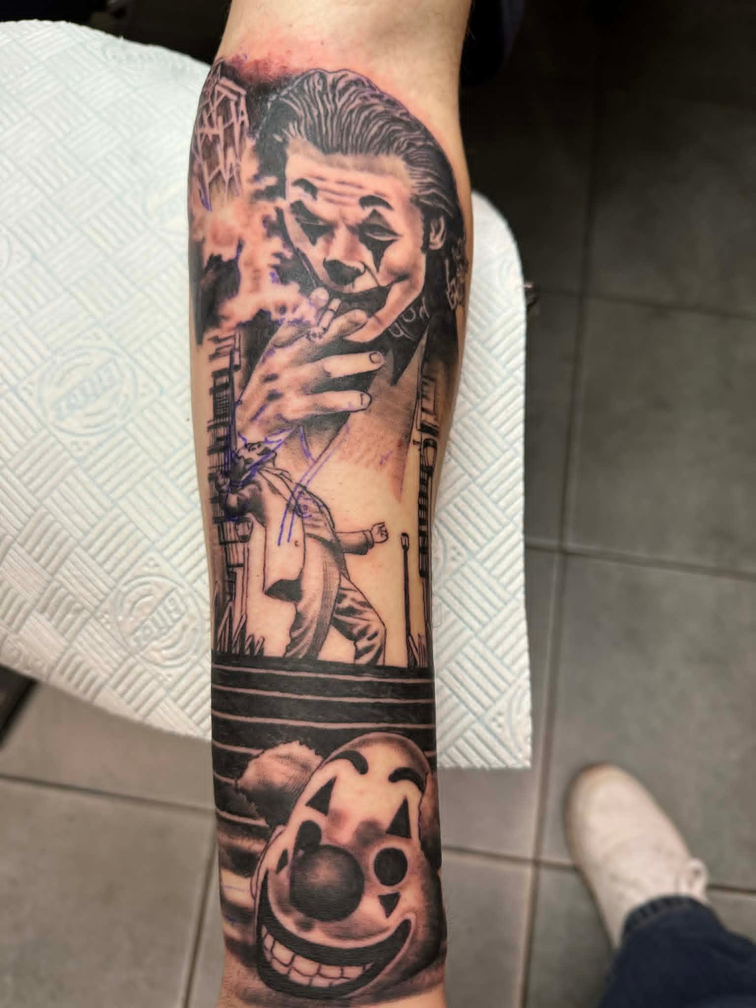 Joker Arthur Fleck movie scene custom black and grey sleeve by John Quinn at Tattoo Zone, tattoos Newcastle.