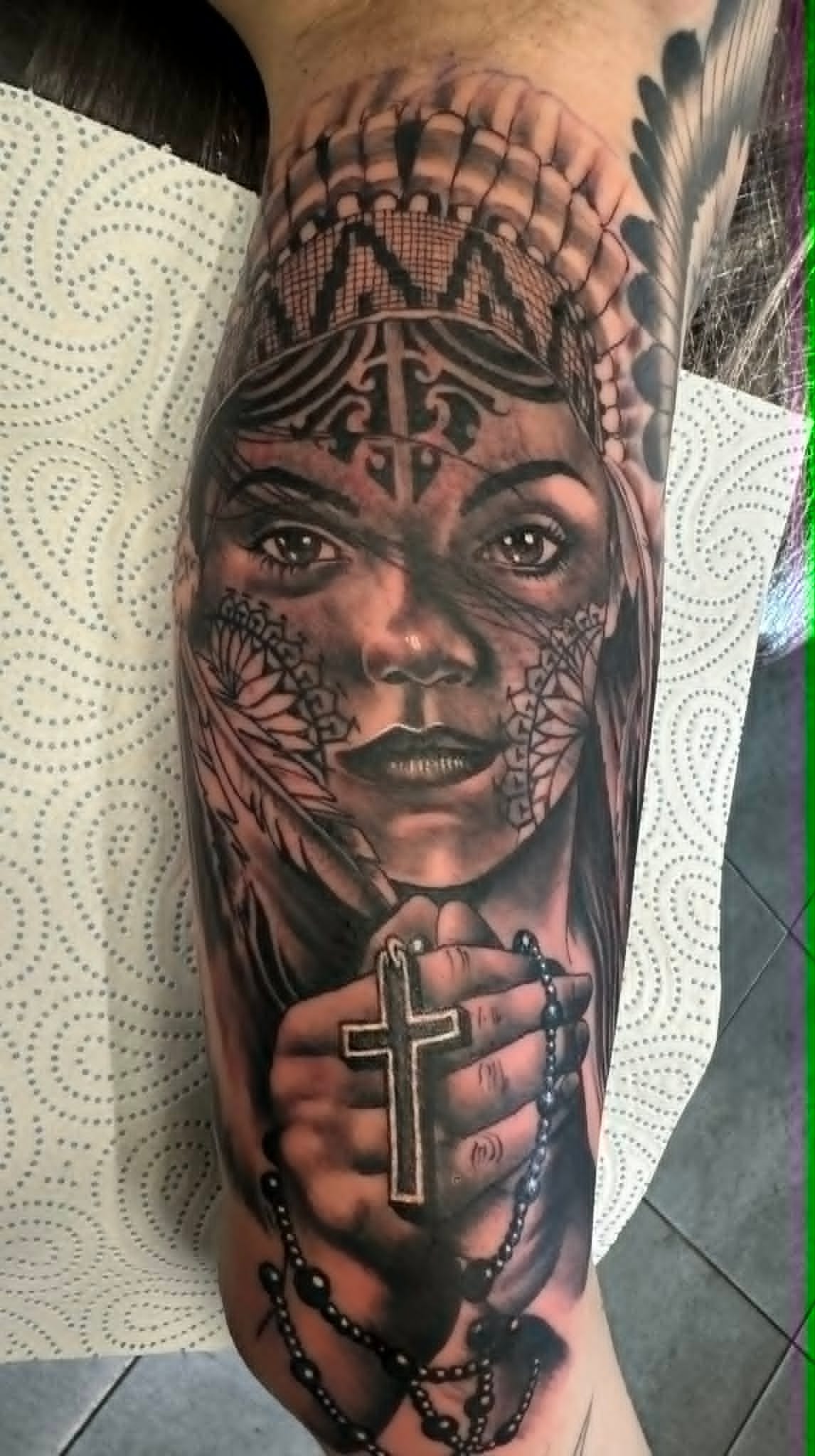 Black and grey La Catrina portrait tattoo with rosary and feathered headdress, tattoos Newcastle by John Quinn at Tattoo Zone.