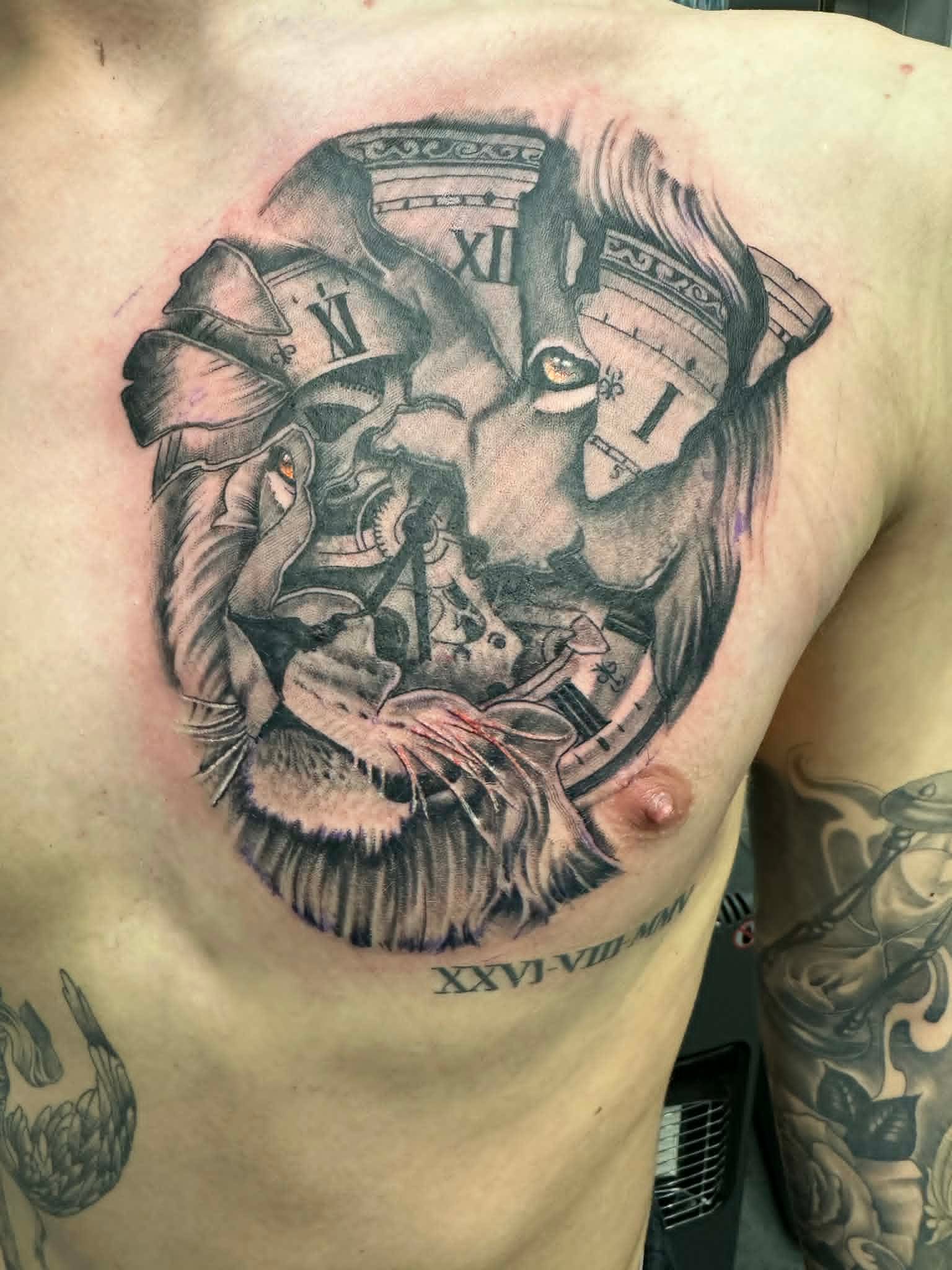 Black and grey lion face merged with broken pillars, clock and Roman numerals chest tattoo by John Quinn at Tattoo Zone Newcastle.