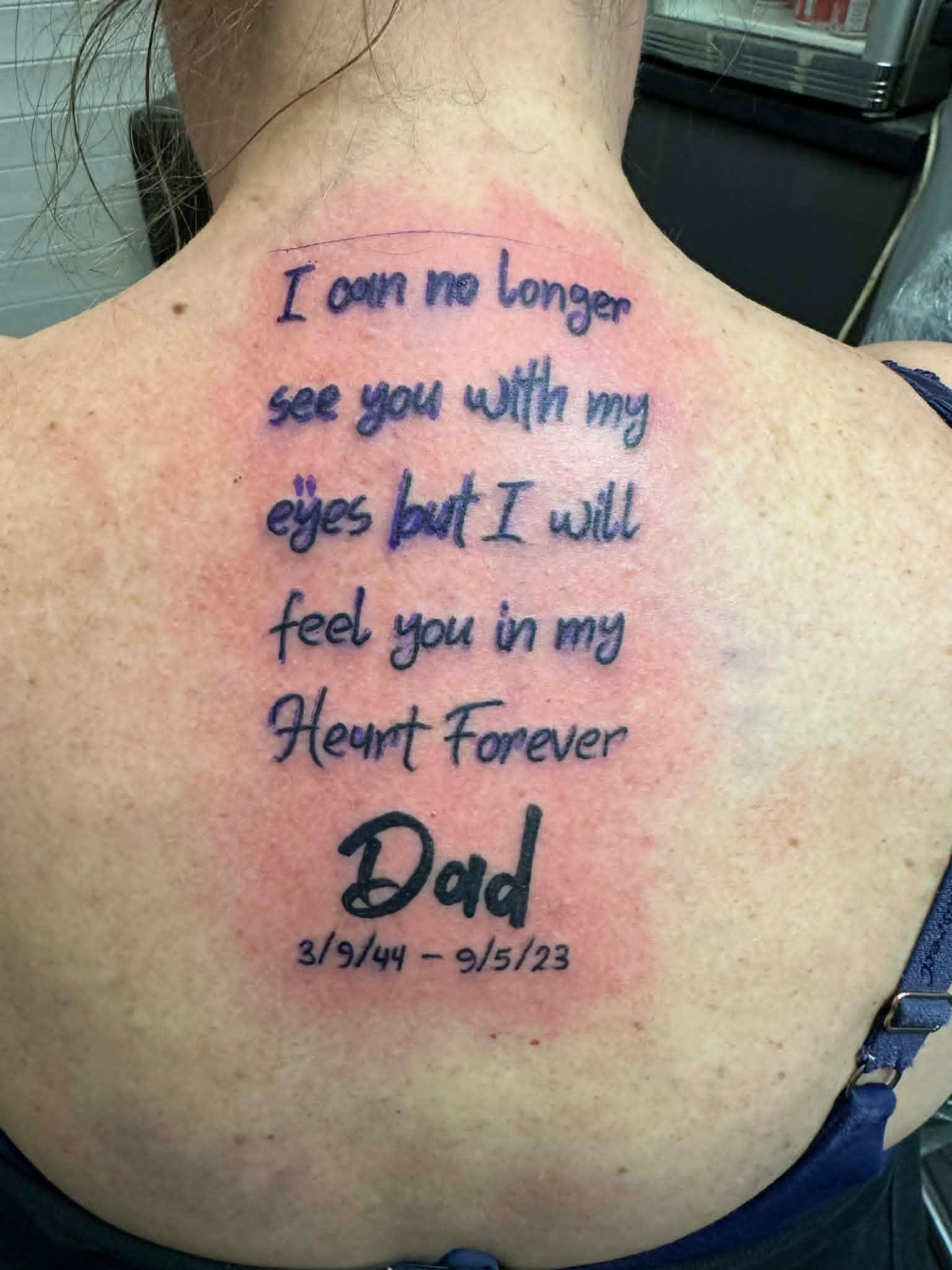 Memorial Dad script lettering tattoo across the upper back by John Quinn at Tattoo Zone Newcastle.