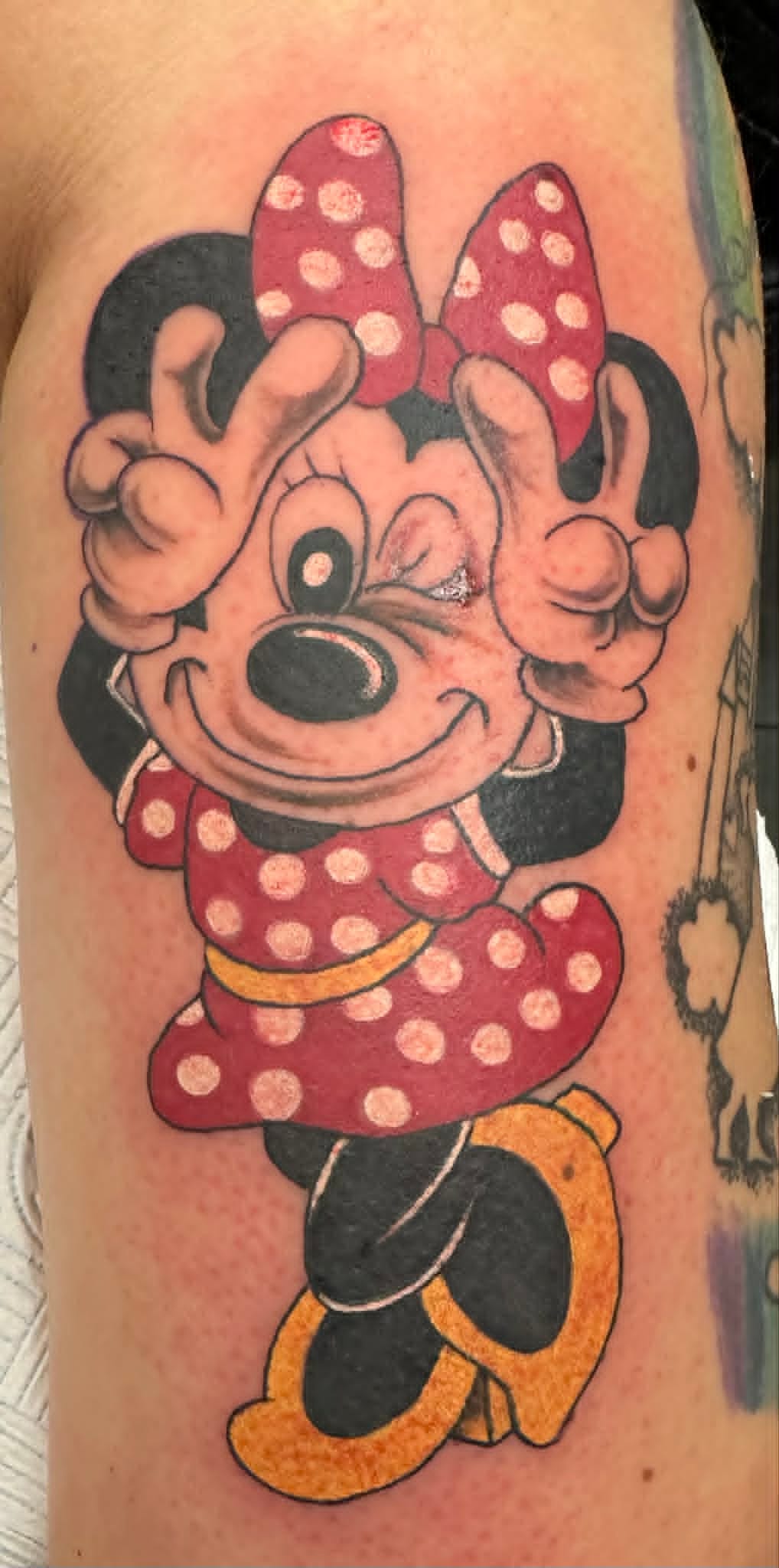 Custom Minnie Mouse cartoon arm tattoo by John Quinn at Tattoo Zone, tattoos Newcastle.