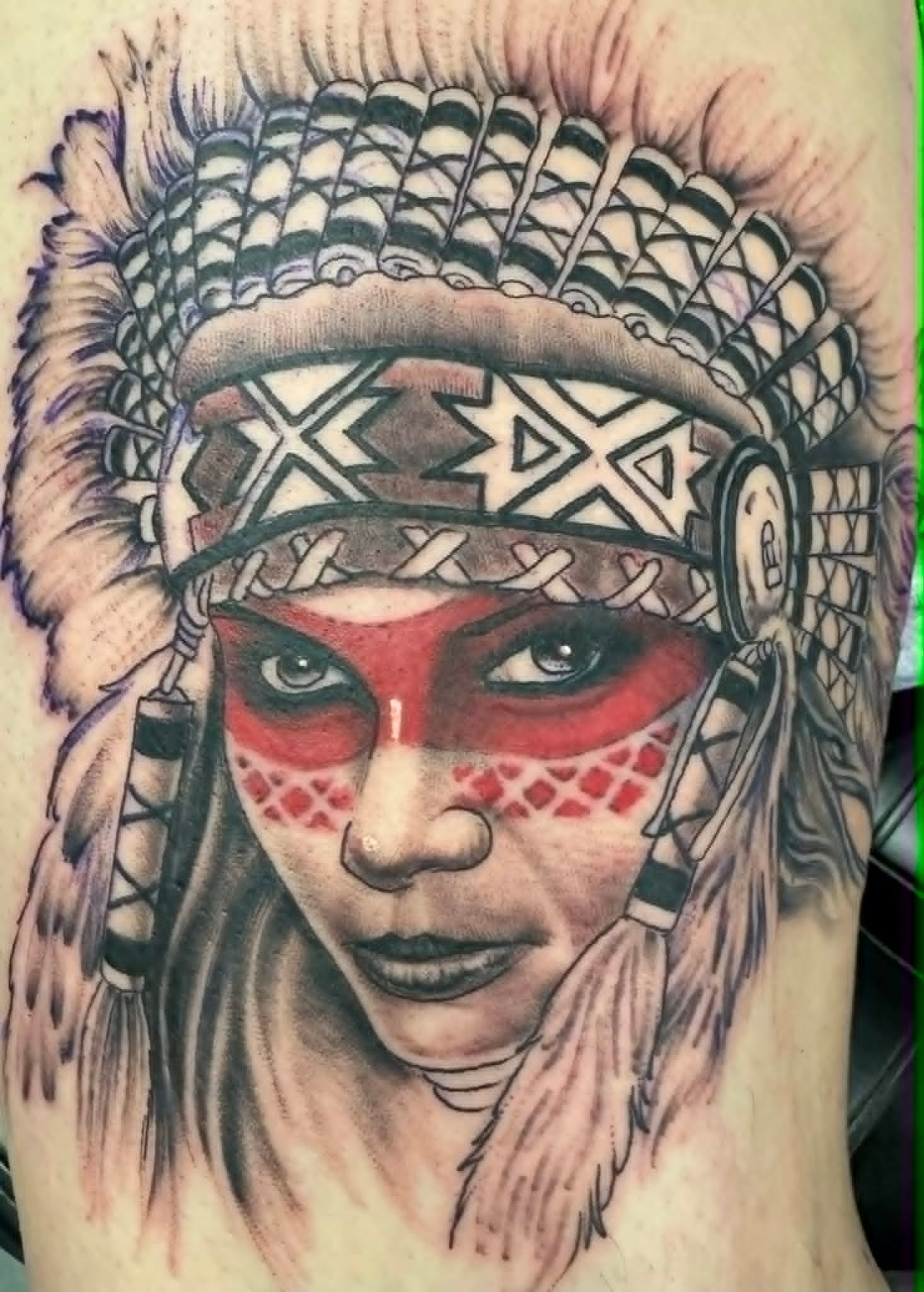 Native American headdress portrait tattoo with red war paint by John Quinn, custom tattoos Newcastle at Tattoo Zone.