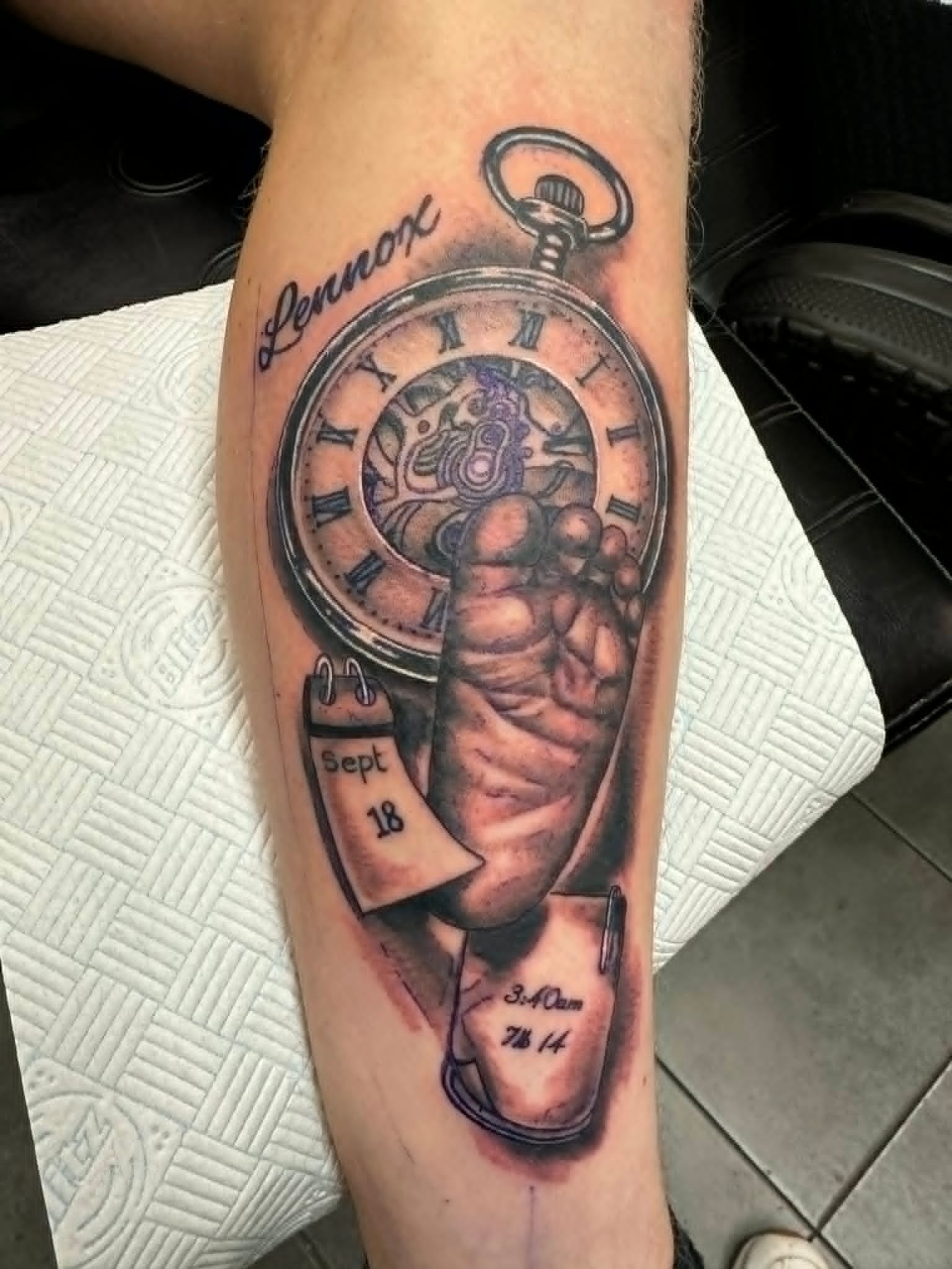 Realism pocket watch with baby hand and Lennox name memorial tattoo on the forearm by John Quinn at Tattoo Zone, tattoos Newcastle.