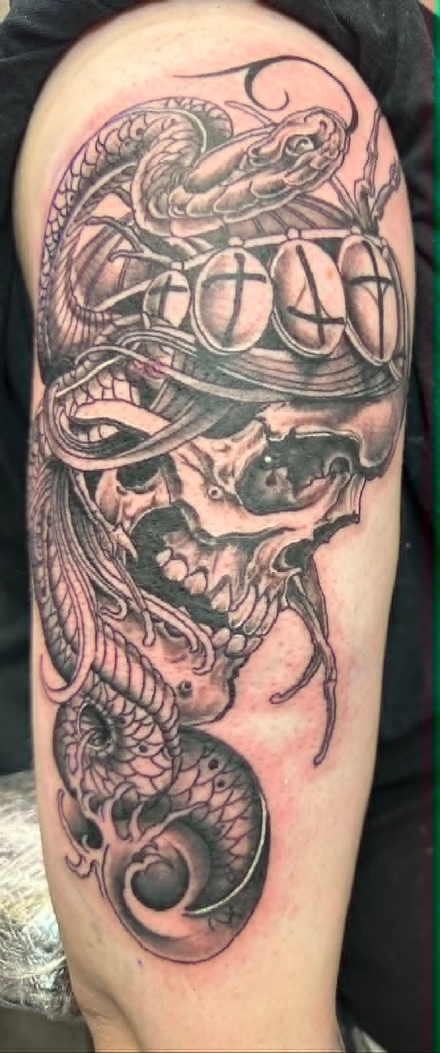 Custom black and grey samurai skull and snake arm tattoo by John Quinn at Tattoo Zone, tattoos Newcastle.