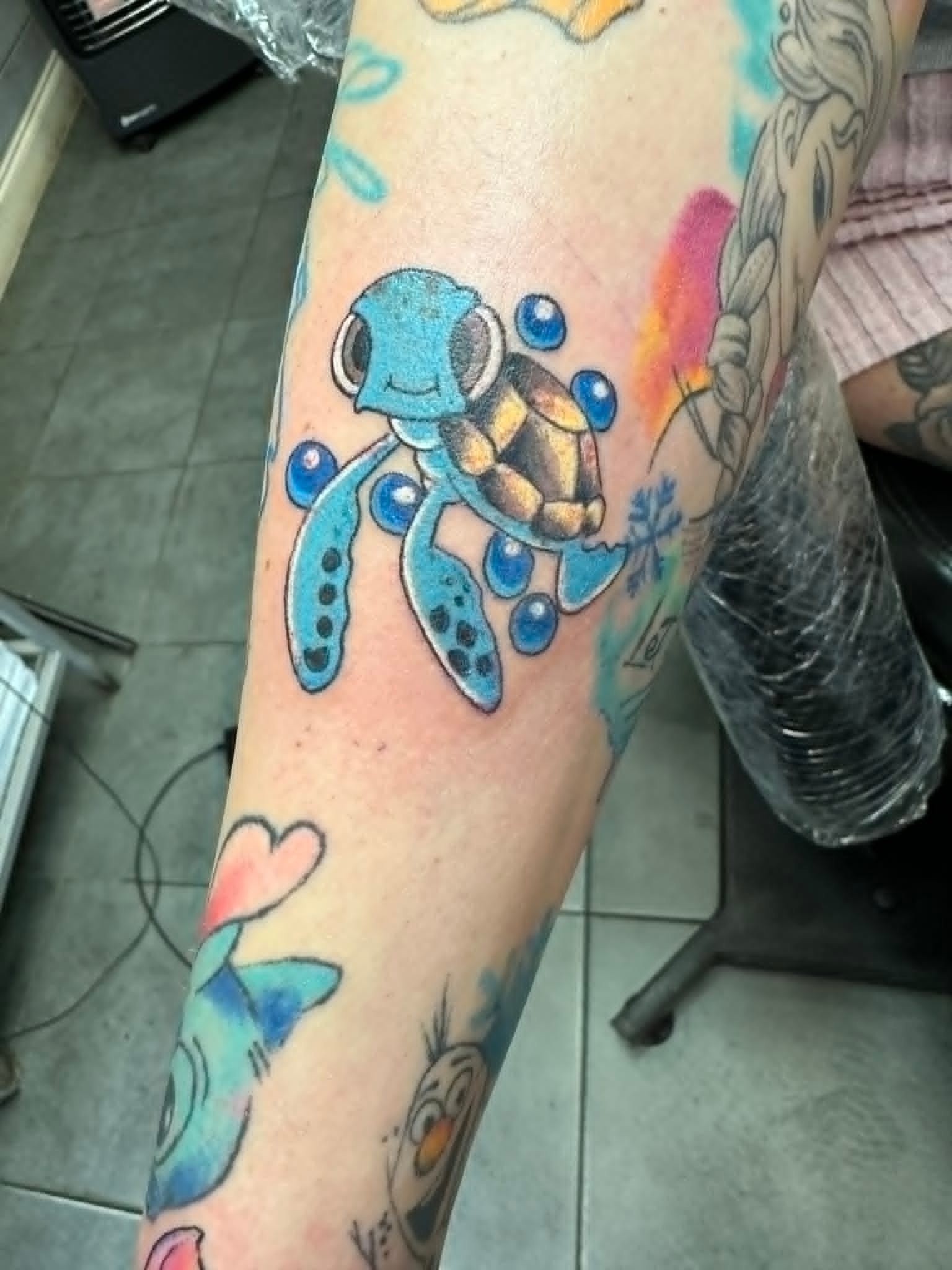 Custom colour Squirtle Pokemon tattoo on the arm by John Quinn at Tattoo Zone, tattoos Newcastle.