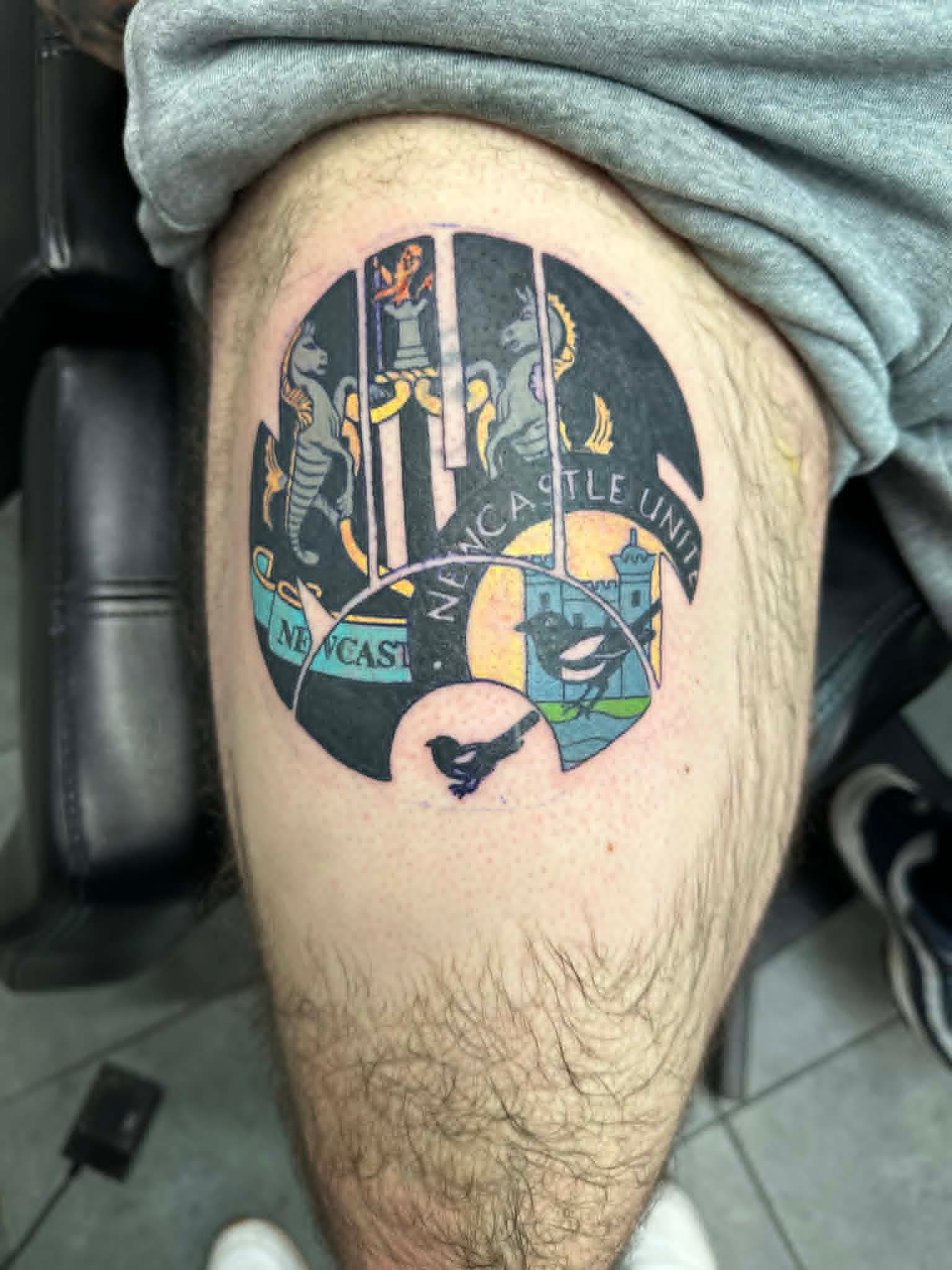 Black and grey character tattoo by John Quinn at Tattoo Zone Newcastle.